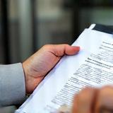 Person reviewing documents.